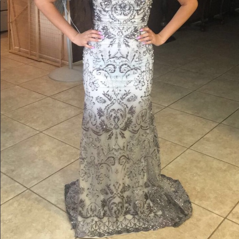 Selling a silver and white dress